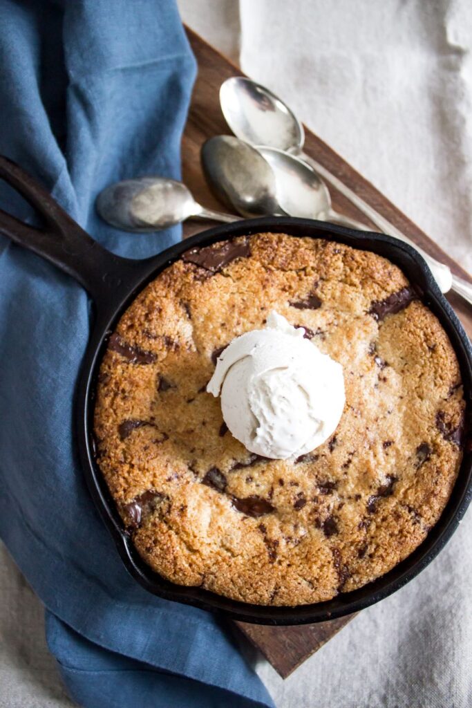 Skillet Chocolate Chip Cookie with a blue napkin.