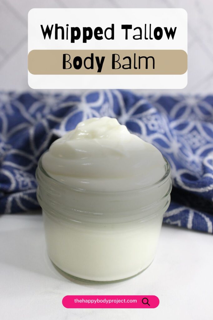 A jar of creamy whipped tallow body balm sits on a surface. Behind it, a blue and white patterned cloth is partially visible. The text above reads "Whipped Tallow Body Balm.