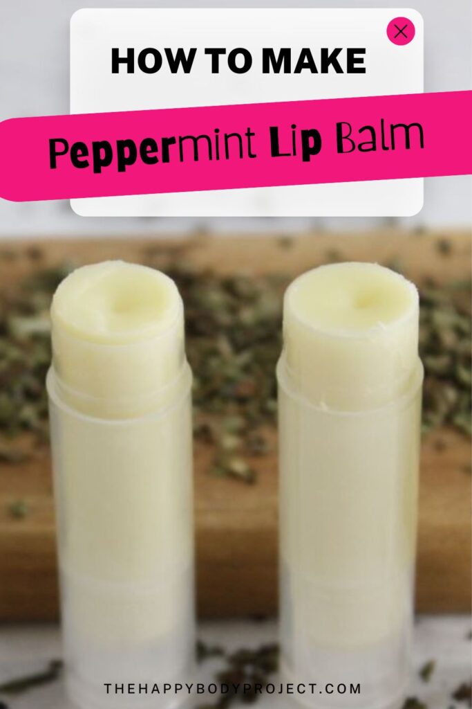 Two tubes of refreshing Peppermint Lip Balm stand upright on a rustic wooden surface, surrounded by dried peppermint leaves. A text overlay proudly reads, "HOW TO MAKE Peppermint Lip Balm" in bold, vibrant white and pink fonts.