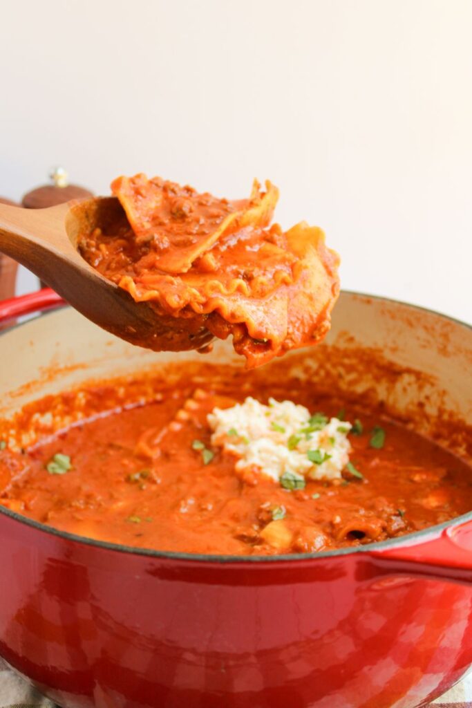 Gluten Free Lasagna Soup in a large pot with a spoon.