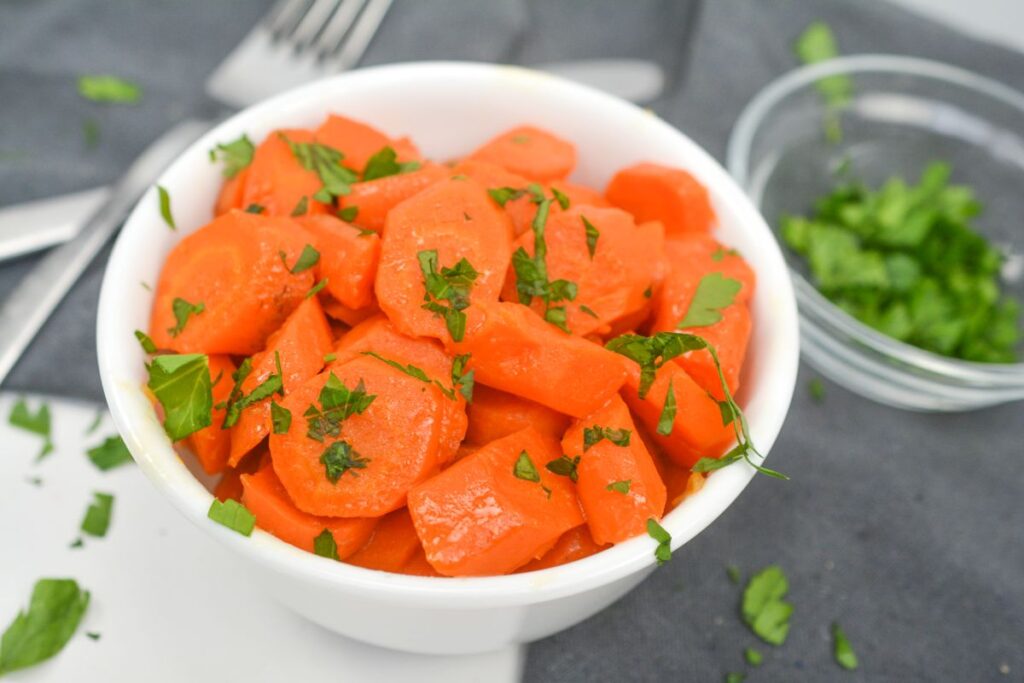 Glazed Carrots in a white bowl.